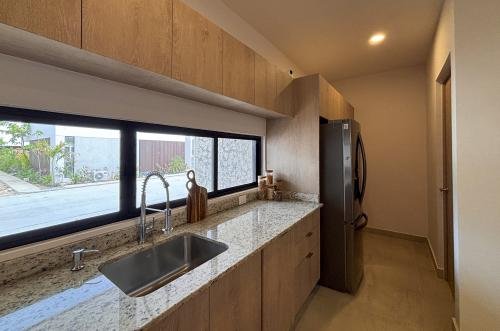 2029-54793-Casa_estilo-Townhouse-en-venta-en-cholul-al-norte-de-Merida-THULA-CITY-HOME__(11).jpg